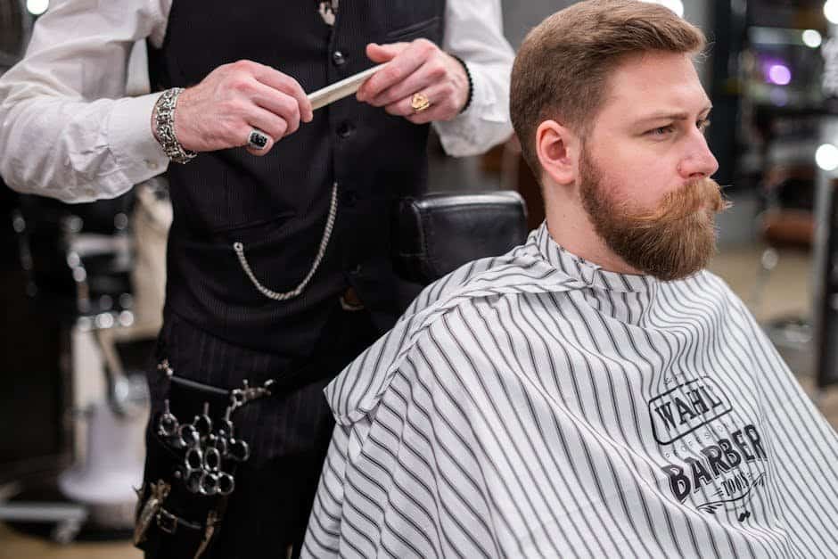 A barber meticulously grooming a bearded man in a stylish barbershop setting, showcasing modern men's grooming.